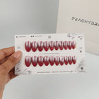 Burgundy Cateye reusable press-on nails for an at-home manicure