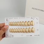 Gold Chrome reusable press-on nails for an at-home manicure