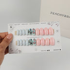 Flamingo Bae press-on nails in oval shapes