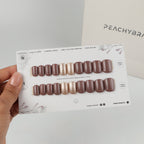 Chocolate Crush & Champagne reusable press-on nails for an at-home manicure